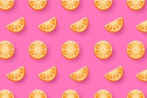 Seamless pattern with Orange fruits candy on pink