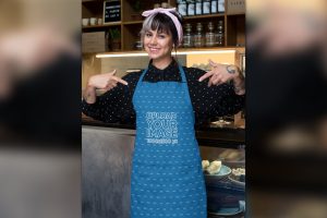 Mockup of a Barista Pointing at Her Sublimated