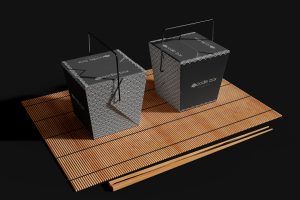 Noodle Box with Chopsticks on a Bamboo Mat