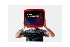 Person with tattoo holding television Mockup