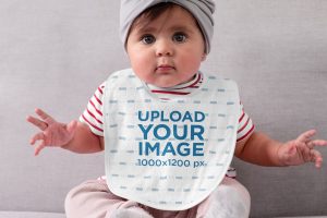 Sublimated Bib Mockup Featuring a Baby Girl