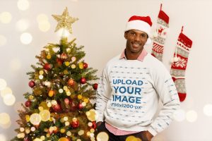 Sweatshirt Mockup of a Man with a Santa Hat Posing