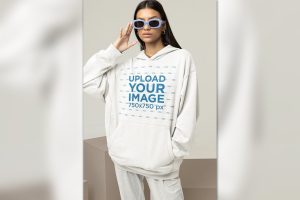Unisex Hoodie Mockup Featuring a Stylish Woman